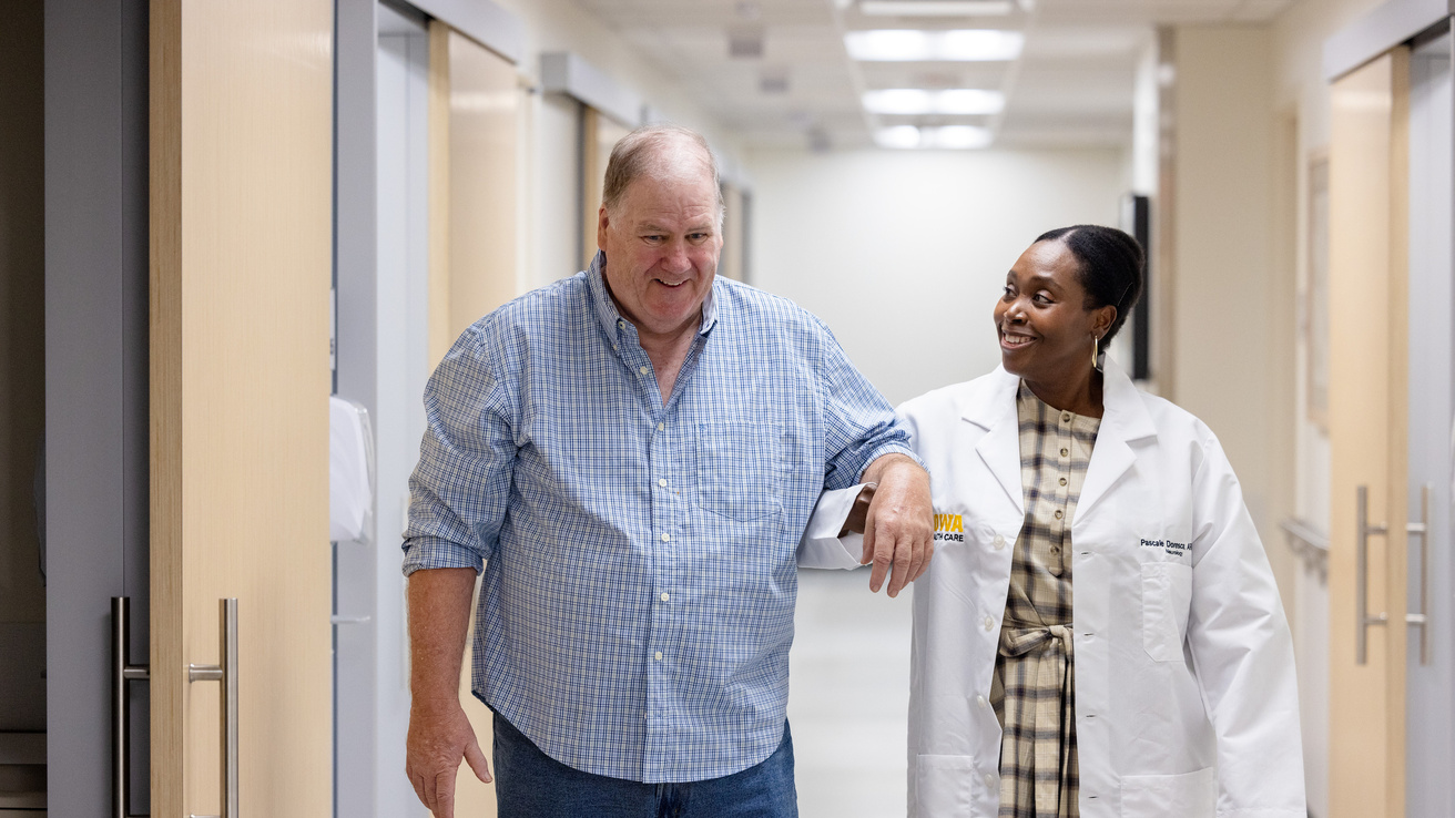 Pascale Doresca and patient walking